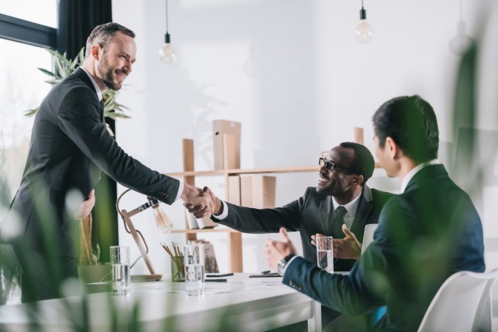 Christian financial advisors shaking hands Christian financial advisors shaking hands