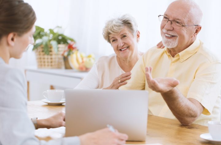 financial advisor with happy clients financial advisor with happy clients