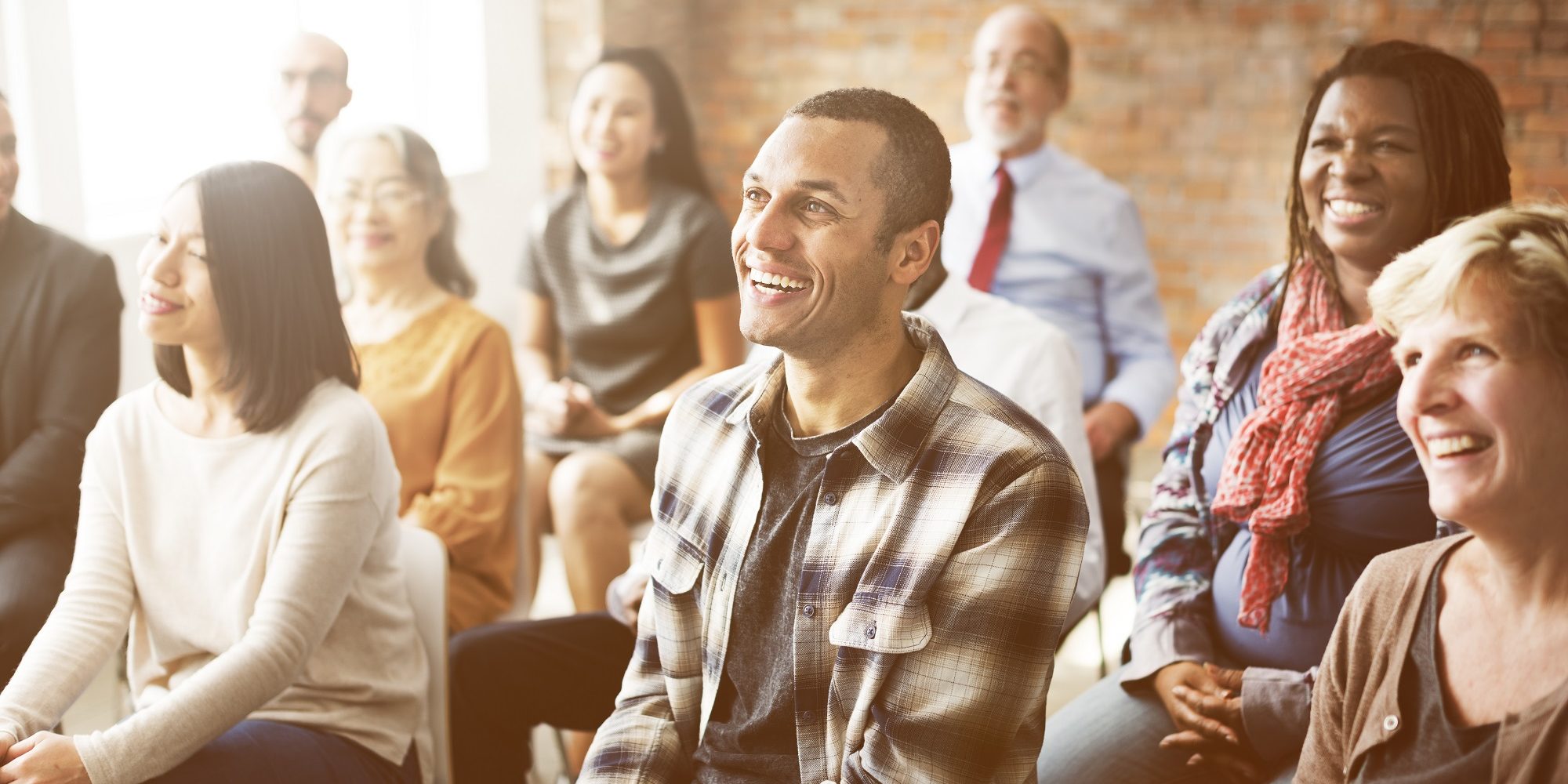 happy employees at benefit meeting