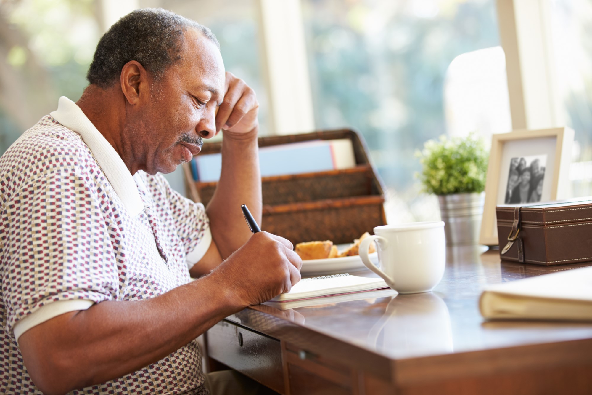 Man writing in journal